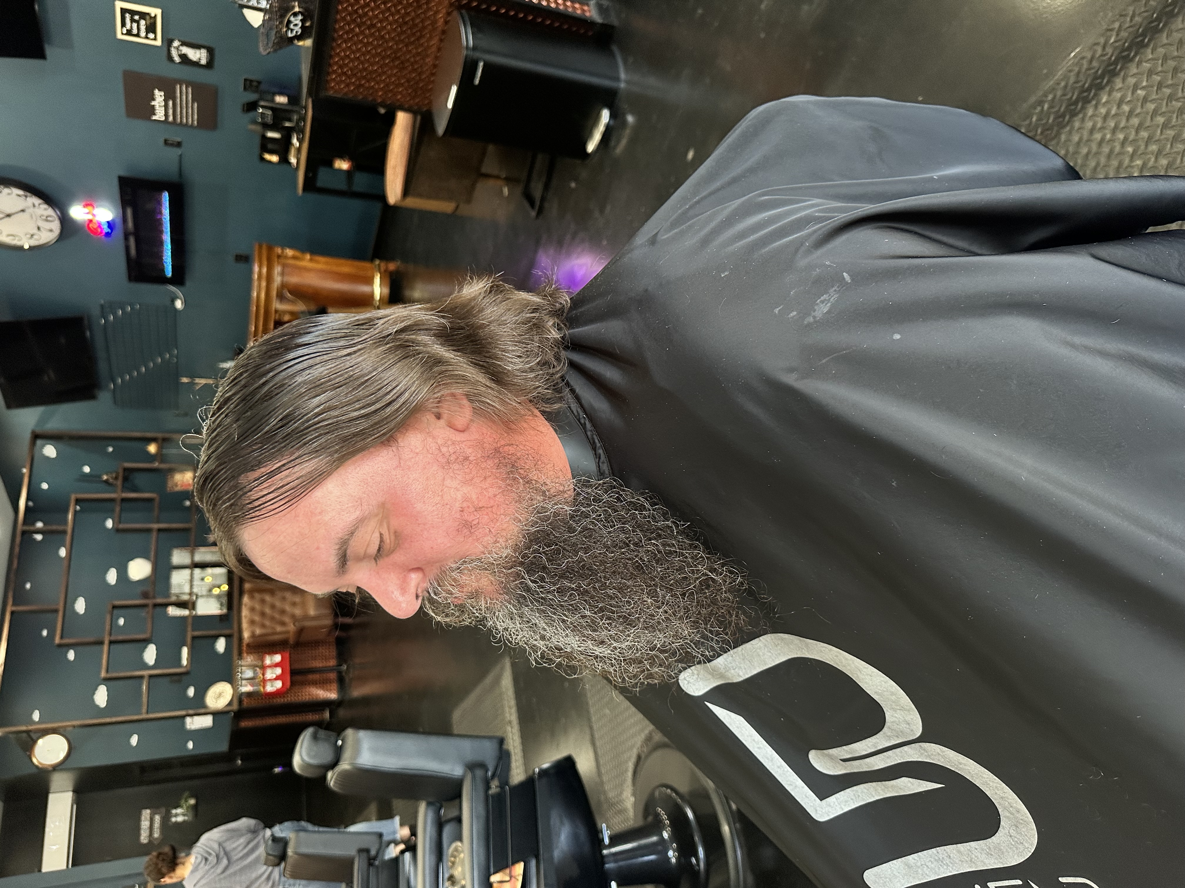 Before: client before a haircut at Steel and Stubble